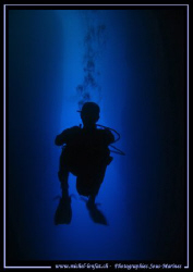 Diver in the cave of the Inland Sea in Gozo - Malta by Michel Lonfat 